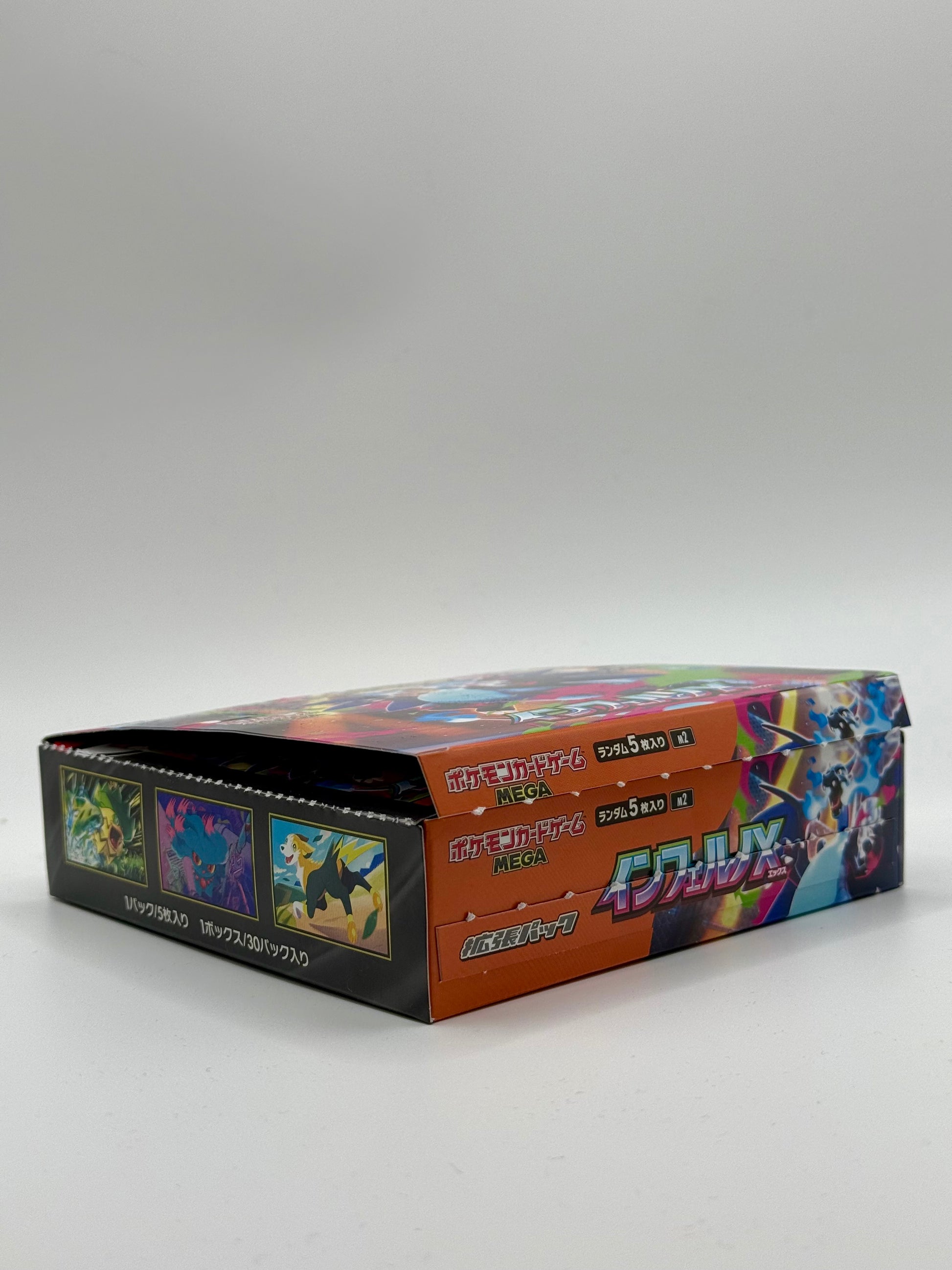 Eevolvd Mega Inferno Booster Box med 30 booster packs med fokus pa oppningen direkt fran Pokemon Center Japan