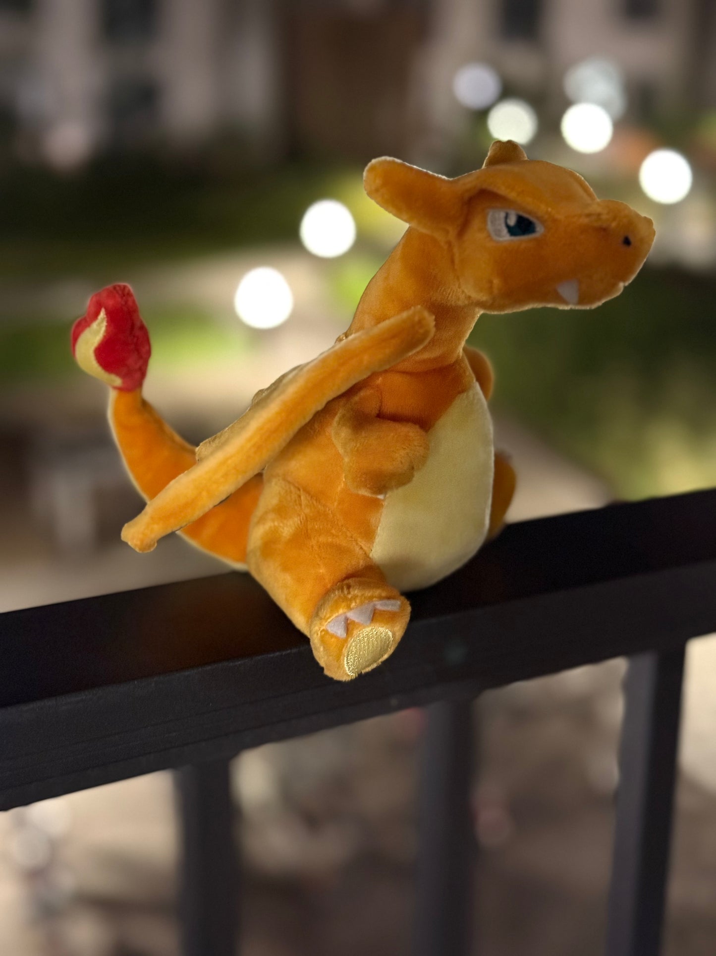 eevolvd charizard plush from pokemon center Japan shot at night